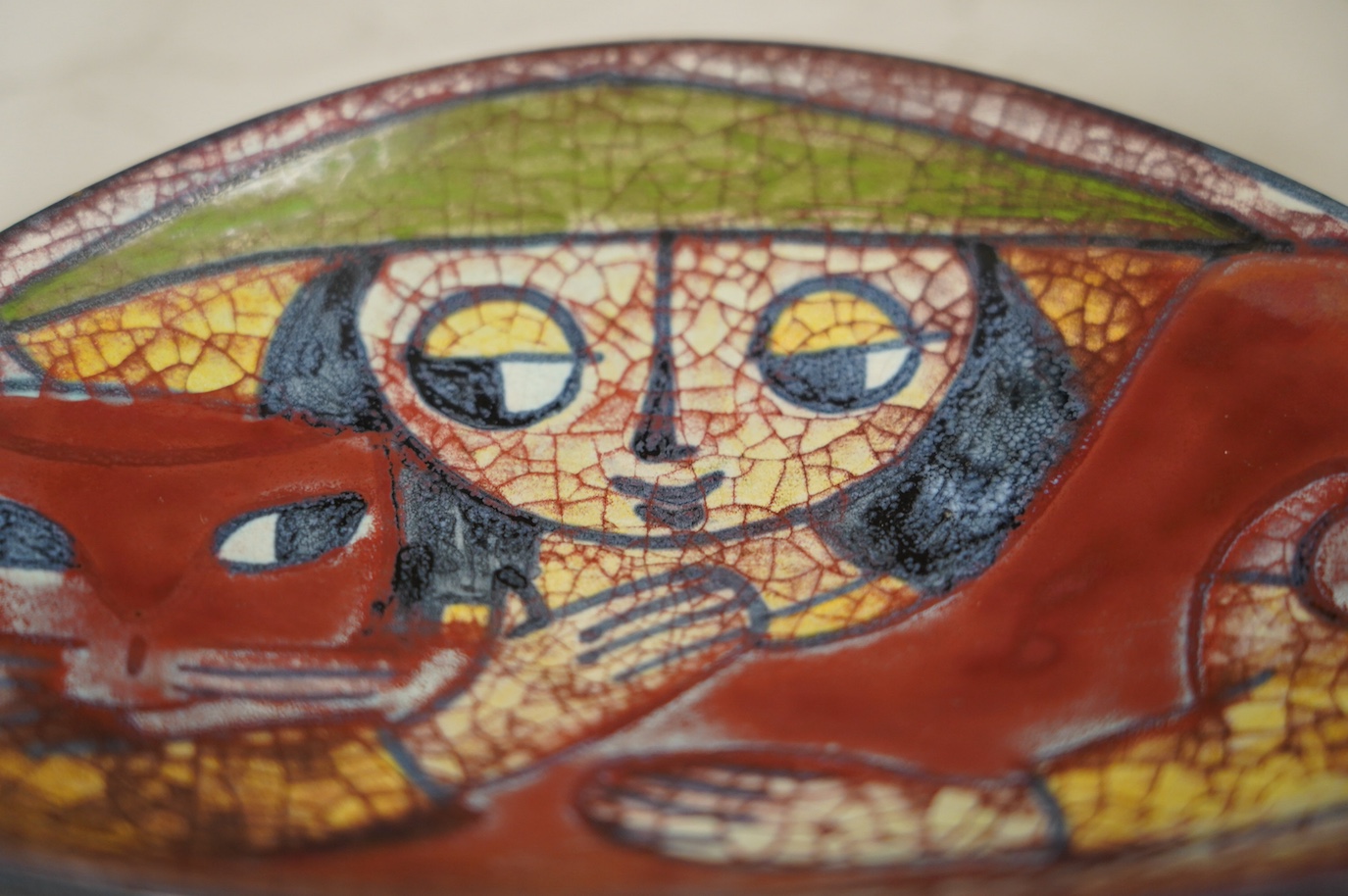 A Michael Andersen lustre stylised 'girl hugging a cat' dish, 20.5cm wide. Condition - good